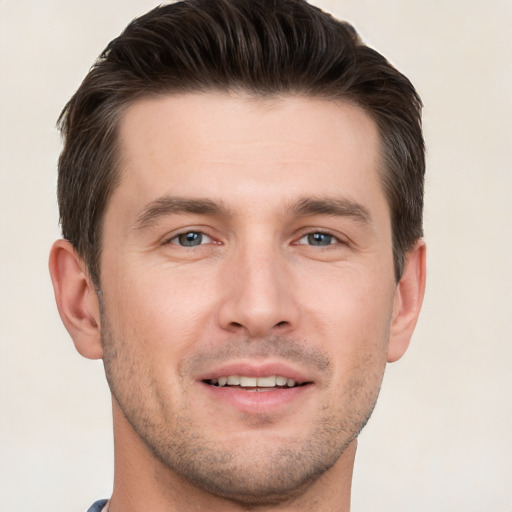 Joyful white young-adult male with short  brown hair and brown eyes