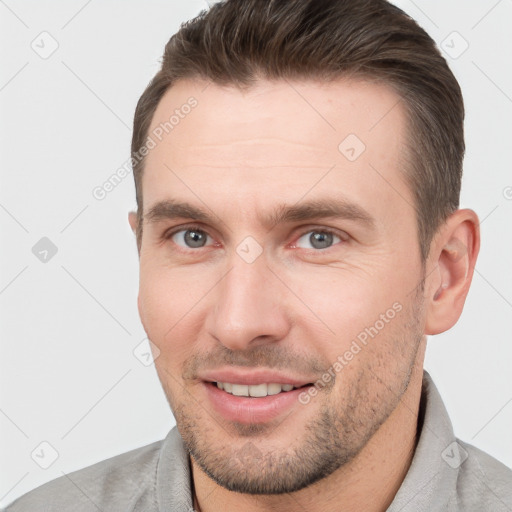 Joyful white young-adult male with short  brown hair and brown eyes