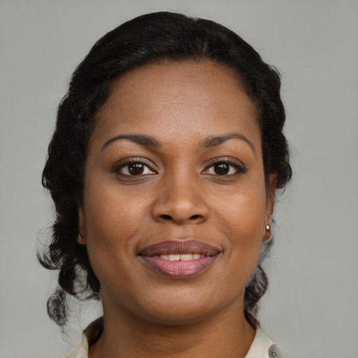 Joyful black young-adult female with medium  brown hair and brown eyes