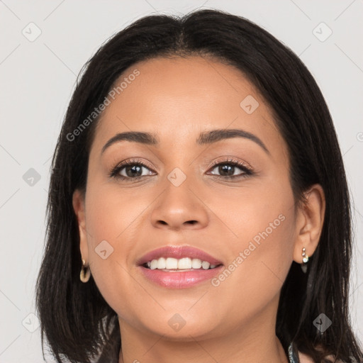 Joyful latino young-adult female with long  brown hair and brown eyes