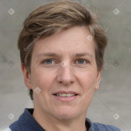 Joyful white adult male with short  brown hair and grey eyes