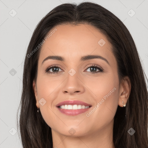 Joyful white young-adult female with long  brown hair and brown eyes