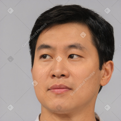 Neutral asian young-adult male with short  black hair and brown eyes