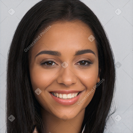 Joyful latino young-adult female with long  brown hair and brown eyes