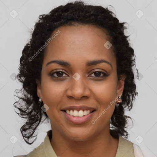 Joyful black young-adult female with long  brown hair and brown eyes