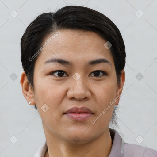 Joyful asian young-adult female with short  brown hair and brown eyes