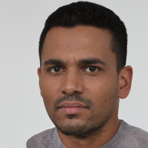 Neutral latino young-adult male with short  black hair and brown eyes