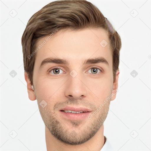 Joyful white young-adult male with short  brown hair and grey eyes