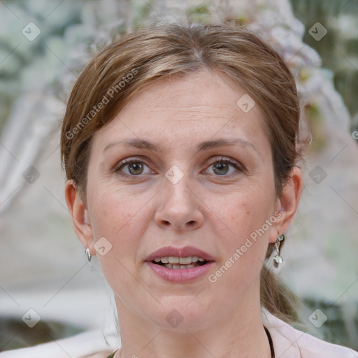 Joyful white adult female with medium  brown hair and grey eyes