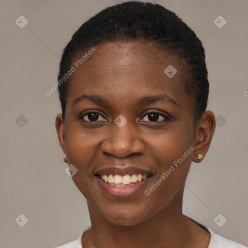 Joyful black young-adult female with short  brown hair and brown eyes