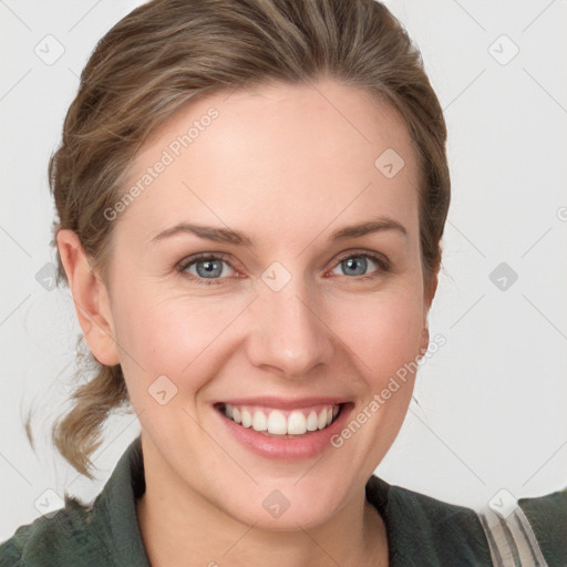 Joyful white young-adult female with medium  brown hair and blue eyes