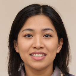 Joyful asian young-adult female with medium  brown hair and brown eyes