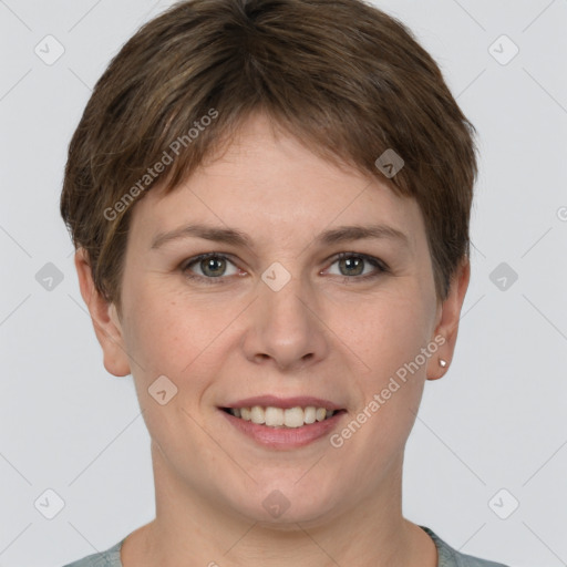 Joyful white young-adult female with short  brown hair and grey eyes