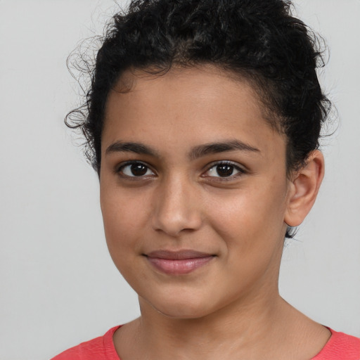 Joyful latino young-adult female with short  brown hair and brown eyes