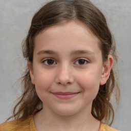 Joyful white child female with medium  brown hair and brown eyes