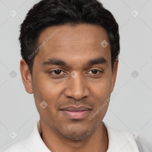 Joyful latino young-adult male with short  black hair and brown eyes