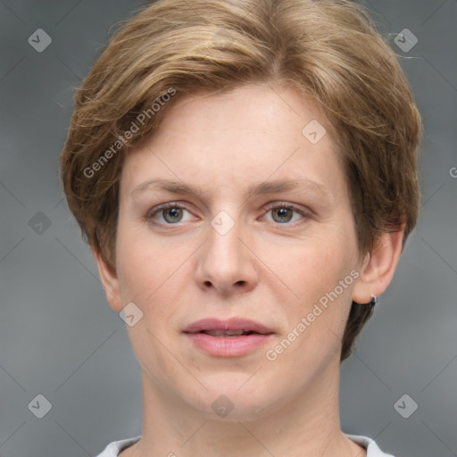 Joyful white adult female with short  brown hair and grey eyes