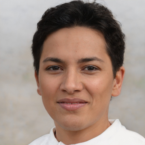Joyful latino young-adult female with short  brown hair and brown eyes
