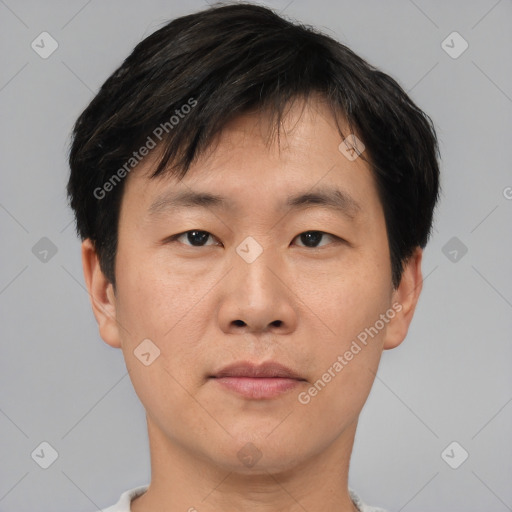 Neutral asian young-adult male with short  brown hair and brown eyes