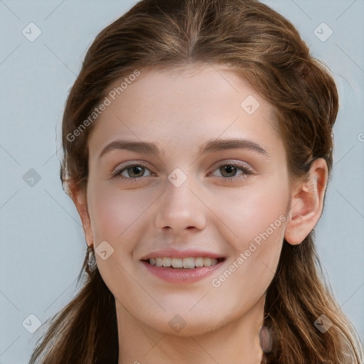 Joyful white young-adult female with long  brown hair and grey eyes