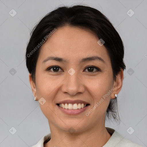 Joyful asian young-adult female with short  brown hair and brown eyes