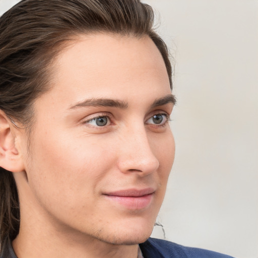 Joyful white young-adult male with medium  brown hair and brown eyes