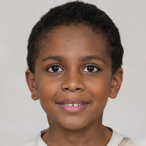 Joyful black child female with short  brown hair and brown eyes
