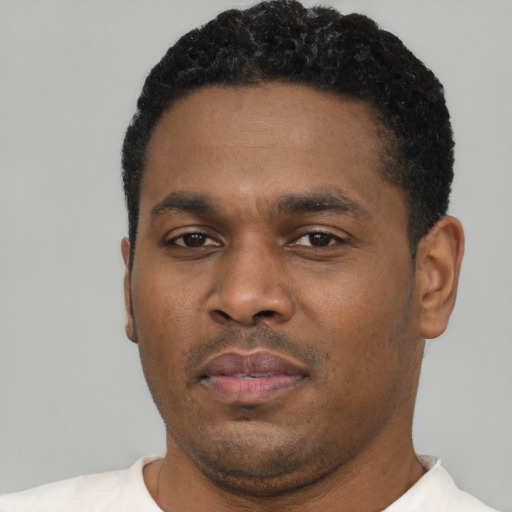 Neutral black young-adult male with short  black hair and brown eyes