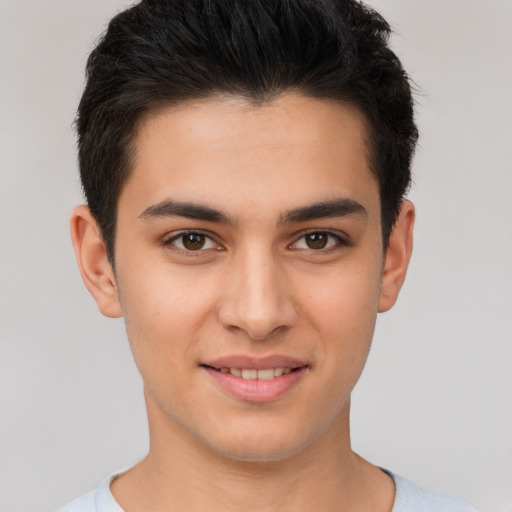 Joyful white young-adult male with short  brown hair and brown eyes