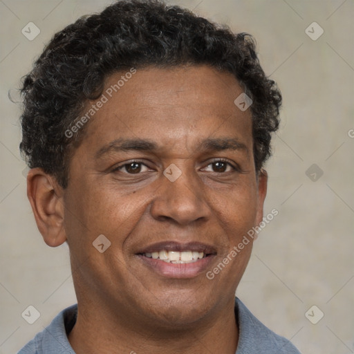 Joyful black adult male with short  brown hair and brown eyes