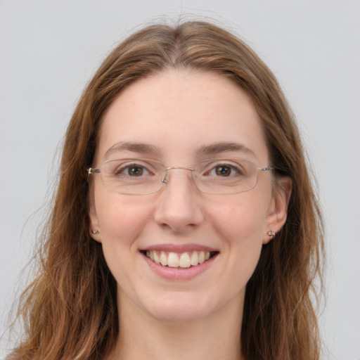 Joyful white young-adult female with long  brown hair and green eyes