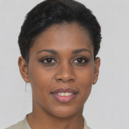 Joyful black young-adult female with short  brown hair and brown eyes