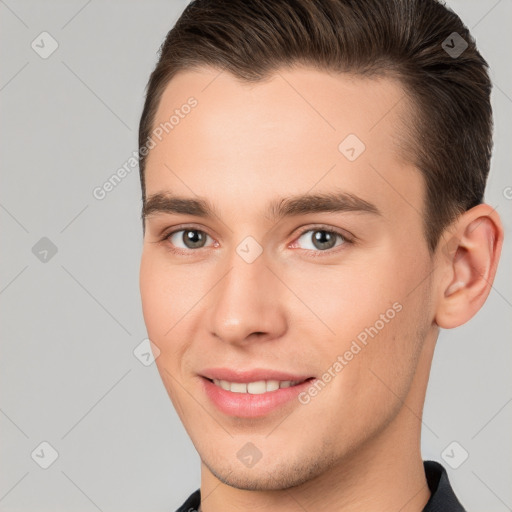 Joyful white young-adult male with short  brown hair and brown eyes