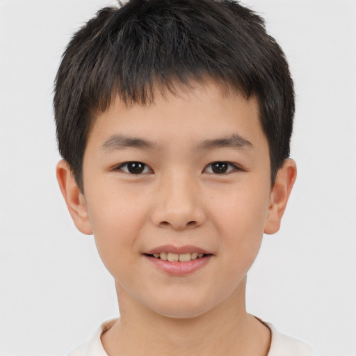 Joyful white child male with short  brown hair and brown eyes