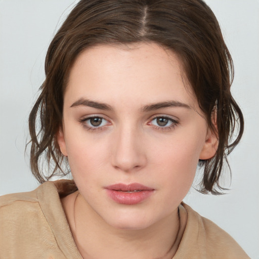 Neutral white young-adult female with medium  brown hair and brown eyes