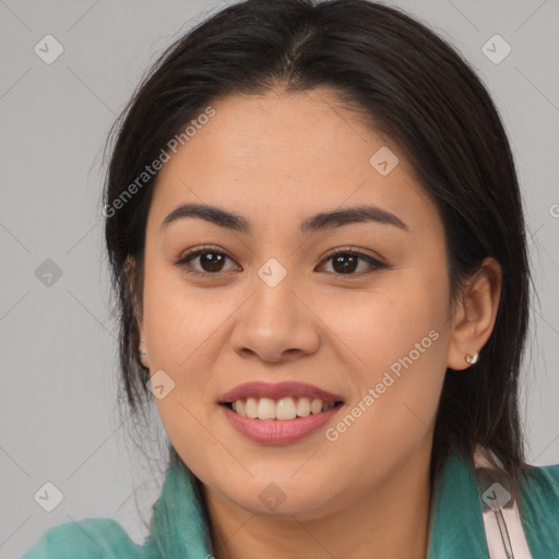 Joyful asian young-adult female with long  brown hair and brown eyes