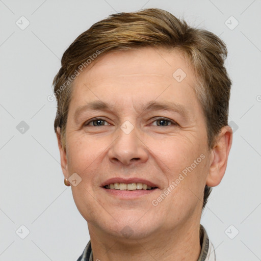 Joyful white adult female with short  brown hair and grey eyes