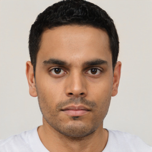 Neutral latino young-adult male with short  black hair and brown eyes