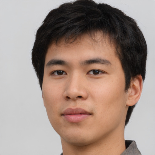 Neutral asian young-adult male with short  brown hair and brown eyes