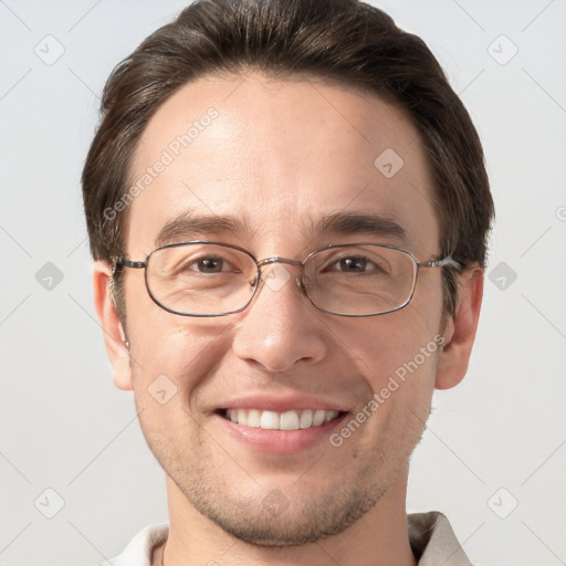 Joyful white adult male with short  brown hair and grey eyes