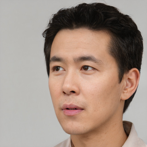Neutral asian young-adult male with short  black hair and brown eyes