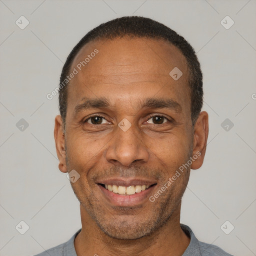 Joyful latino adult male with short  black hair and brown eyes