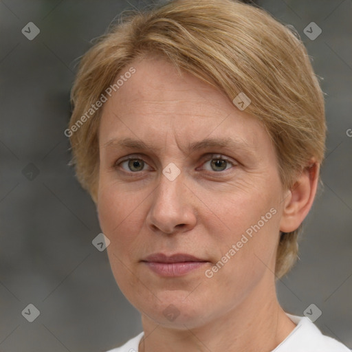 Joyful white adult female with medium  brown hair and green eyes