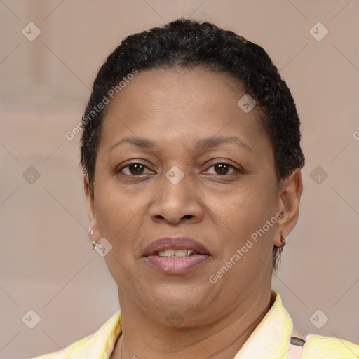 Joyful black adult female with short  brown hair and brown eyes