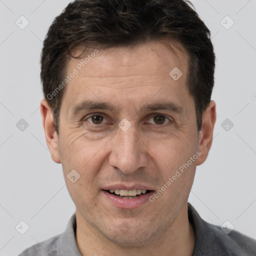 Joyful white adult male with short  brown hair and brown eyes