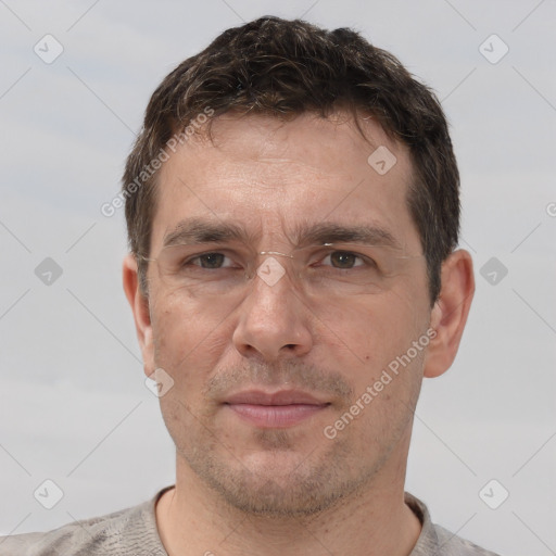 Joyful white adult male with short  brown hair and brown eyes