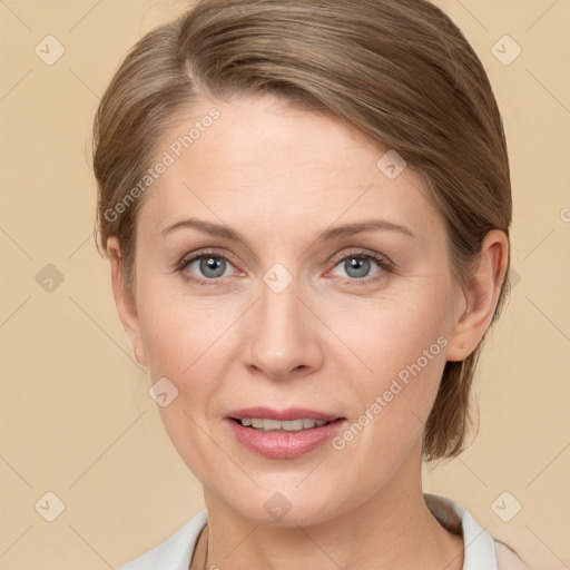 Joyful white adult female with medium  brown hair and grey eyes