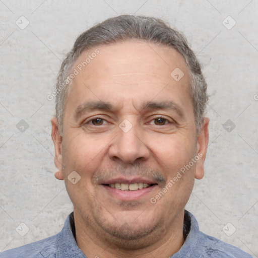 Joyful white adult male with short  brown hair and brown eyes