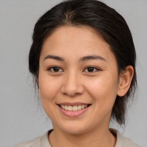 Joyful white young-adult female with medium  brown hair and brown eyes