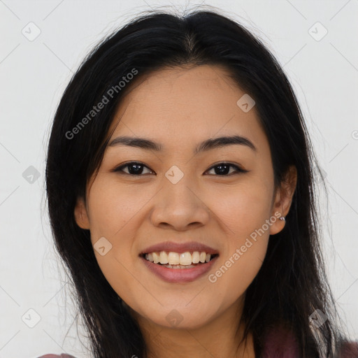 Joyful asian young-adult female with long  brown hair and brown eyes